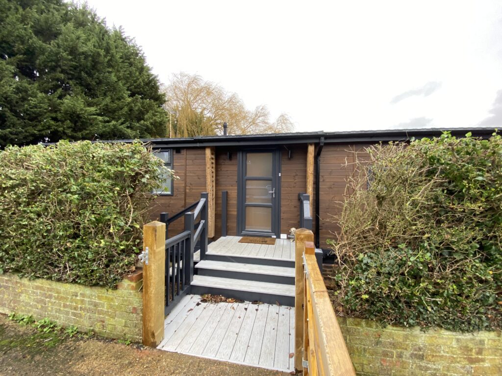 Luxury bespoke built mobile home lodge with entrance decking